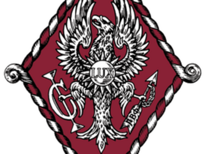 Eagle with spread wings on a red diamond, surrounded by a rope border.