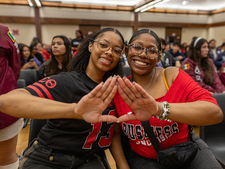 Two women attend the annual Stroll Off.
