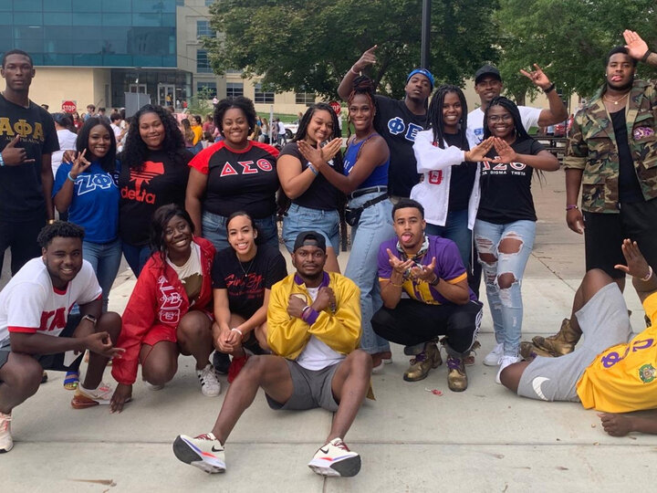 A group shot of posing students