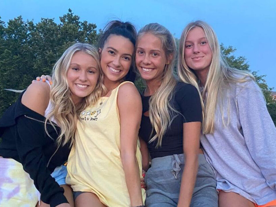 Four sorority members smiling